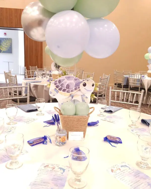 Turtle centerpiece with sage and baby blue balloons