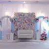Luxury floral baby shower backdrop with pastel theme and couch