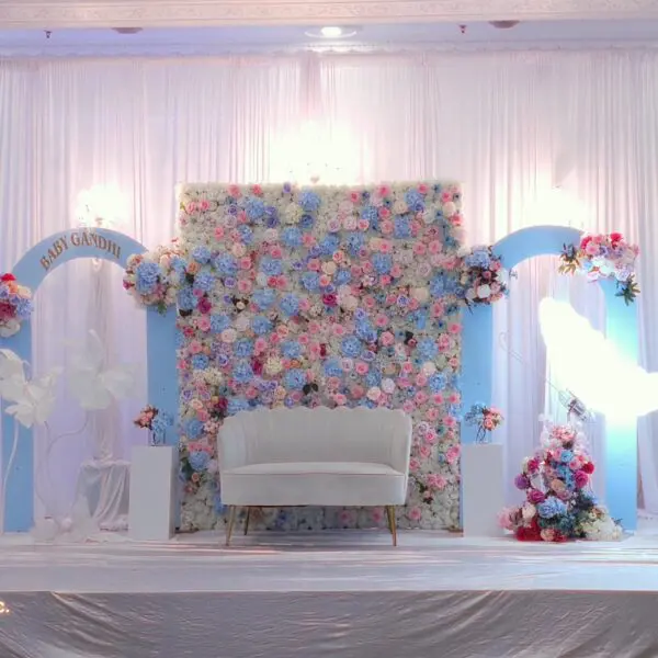 Close-up of flower wall backdrop with mixed pastel roses and hydrangeas