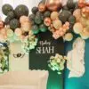 Floral pillars with white roses and sage greenery for baby shower decor