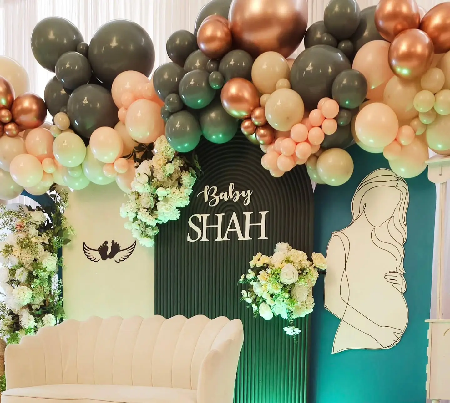 Floral pillars with white roses and sage greenery for baby shower decor