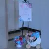 Welcome sign for Kiran’s Baby in Bloom baby shower with floral decor