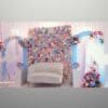 Full baby shower stage decor with arches and white flower accents