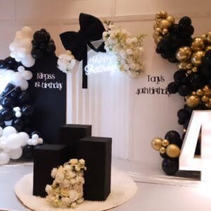 Gold and black balloon backdrop with Tony's 40th birthday custom signage