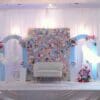 Close-up of flower wall backdrop with mixed pastel roses and hydrangeas
